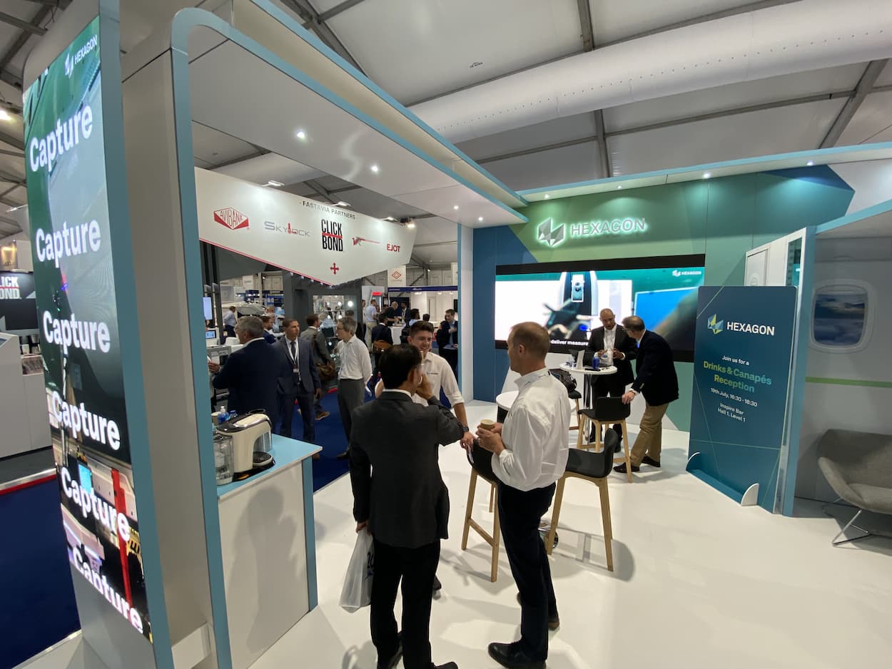 Hexagon Manufacturing Stand with people